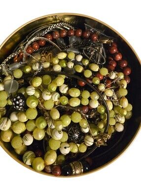 3.14 lbs jewelry in a vintage tin